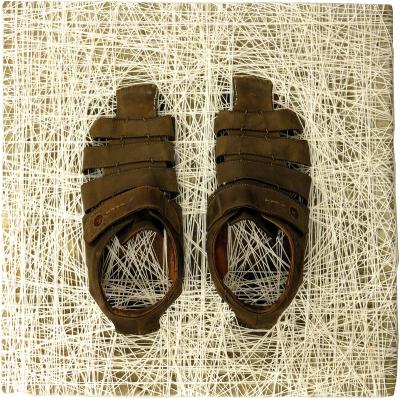 Sławomir Brzoska, Nothing but the Desert (fragment), concrete, wool, sandals, photography